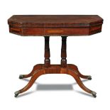 A Regency rosewood pedestal card table, the top inlaid with a band of cut brass to a crossbanded