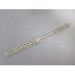 An Art Deco diamond bracelet cased by Carrington, designed with a principal old cushion cut