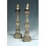A pair of late 18th century Italian silvered wood candlesticks now as lamps, fitted for electricity,