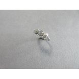 A three stone diamond ring set in 18ct white gold, the three graduated old round brilliant cut