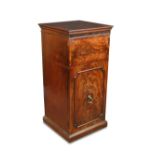 A George III mahogany dining room pedestal, fitted internally for warming plates, with a panel