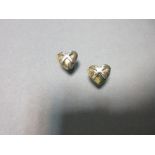 A pair of hallmarked bi-coloured gold 'hearts and kisses' earrings, each post headed by a yellow