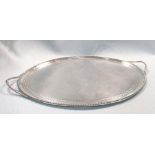 A George III silver tray, by George Burrows, London 1796, oval with beaded edge and two loop