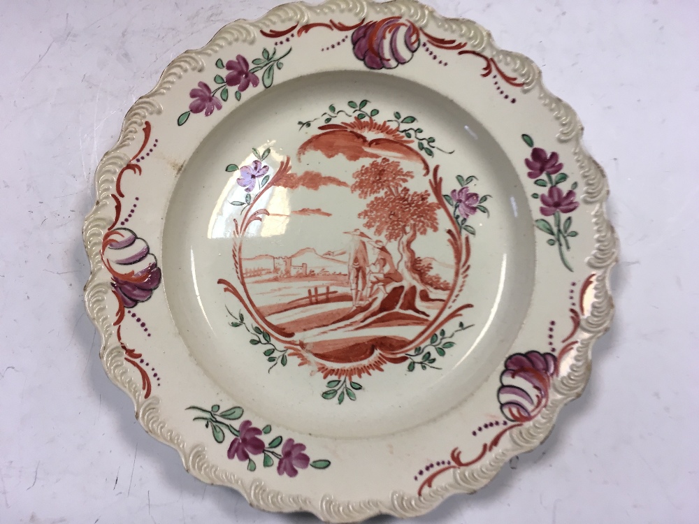 A set of four 18th century Leeds creamware plates, each painted to the centre in iron red with two - Image 2 of 3