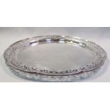 A George V silver salver, by Henry Williamson Ltd, Birmingham 1912, shaped circular with pierced