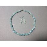 An aquamarine necklace together with a pair of aquamarine & seed pearl earpendants, the necklace
