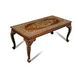 A moorish ivory inlaid hardwood occasional table - early 20th century, the rectangular top profusely