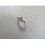A 1ct single stone diamond ring with rose cut diamond shoulders, the old round brilliant cut