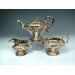 A William IV silver three piece tea service, probably by J. Whitehouse, London 1832, the ogee