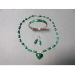 A suite of malachite jewellery, the malachite and seed pearl necklace composed of oval polished