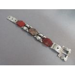 A Victorian Scottish agate mounted buckle bracelet, the three shaped stone panels, two of