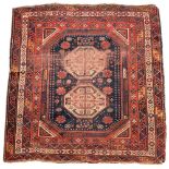 An unusual Quasqhai rug- early 20th century, 200 x 186cm (78 x 73in) Very low pile in areas and