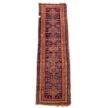 A Qasqai runner - early 20th century, 396 x 100cm (154 x 39in) Some losses to the borders, some