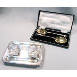 A silver inkstand and a pair of cased serving spoons, The inkstand by the Goldsmiths and