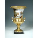 A Paris porcelain two handled vase, the urnular body richly gilt and tooled with cherubs and
