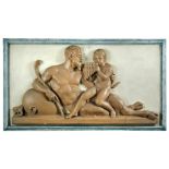 A painted wooden panel with applied composition relief of Pan teaching Dionysius to play the