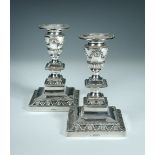 A Victorian pair of Adam style silver candlesticks, by James Deakin & Son, London 1888, the pedestal