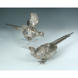 A pair of continental silver models of pheasants, circa 1900, the cock bird stamped '835', 42cm (