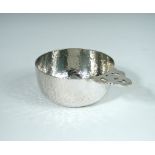 An Edwardian silver porringer, by Millar Wilkinson, London 1904, with hammered finish and pierced