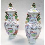 A pair of 19th century Mason's two handled vases and covers, of panelled baluster form with snake