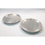 A pair of Victorian silver waiters, by Robert Garrard, London 1845, each of circular form within a