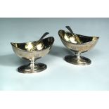 A pair of George III navette shaped pedestal salts and associated spoons, probably by William