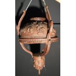 A North European carved wood ceiling light, the dished shade carved with scroll work and classical