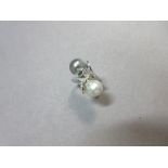 A cultured grey pearl, white pearl and diamond ring set in 18ct white gold, each of the two drop