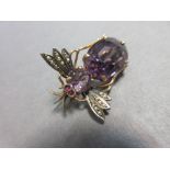 An amethyst bee brooch together with a spider and fly brooch, the first with a round cut amethyst