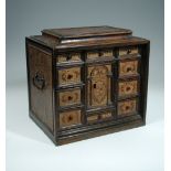 A late 17th century leather inset walnut spice cabinet or Vargueno, probably Spanish, the top, back,