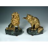 After Philippe Caffieri (1714-1774), a pair of gilt bronze figures of a cat and of a poodle, each