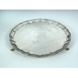 A George III silver salver, by Richard Rugg, London 1767, with shaped and gadrooned edge, raised