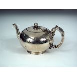 A Victorian silver bullet shaped teapot, by The Barnards, London 1857, engraved with the crest of