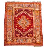 An Anatolian rug - late 19th/early 20th century, previously displayed as a wall hanging 174 x