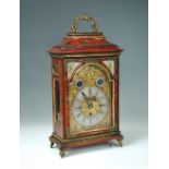 An 18th century German or Austrian red chinoiserie three train bracket clock, the carrying handle