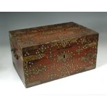 A 19th century Colonial brass bound padouk chest, with hinged lid, brass bound corner and applied