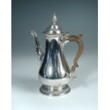 A large George III silver coffee pot, maker's mark indistinct, London 1765, of plain baluster form