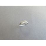 A mid 20th century two stone diamond ring, the two round brilliant cut diamonds claw set side by