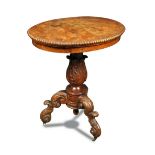 A William IV figured elm pedestal table, the oval top with a gadroon moulded border, on a leaf
