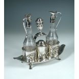 An old Sheffield plate cruet set, the navette shaped stand fitted with two bottles, mustard and a