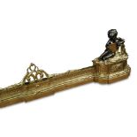 A Louis XVI style French ormolu fender - late 19th century, extending and mounted at each end with a