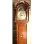 An oak chiming longcase clock, the 12inch brass dial with moonphase disc to the arch, urn spandrels,