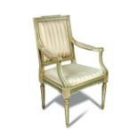 A Continental painted and parcel gilt open armchair - 18th century, with upholstered back panel