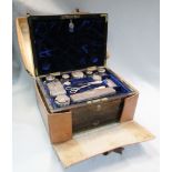 A Victorian coromandel wood travelling dressing case, the blue velvet interior fitted with silver