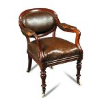 A mahogany and leather Campaign chair - 19th century, the brass nailed oval back and seat on