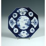 A Bow blue and white octagonal plate, circa 1765, the powder blue ground body reserved with a