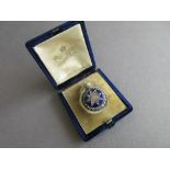 A 19th century diamond and blue enamel locket in fitted Garrard case, the circular blue guilloche