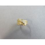 An Edwardian 18ct gold and diamond snake ring, the serpent in three coils around the finger with the