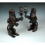 A pair of bronze Renaissance-style lion candleholders, probably late 19th or early 20th century