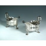 A substantial pair of early Victorian cast silver sauce boats, by Robert Garrard, London 1839,